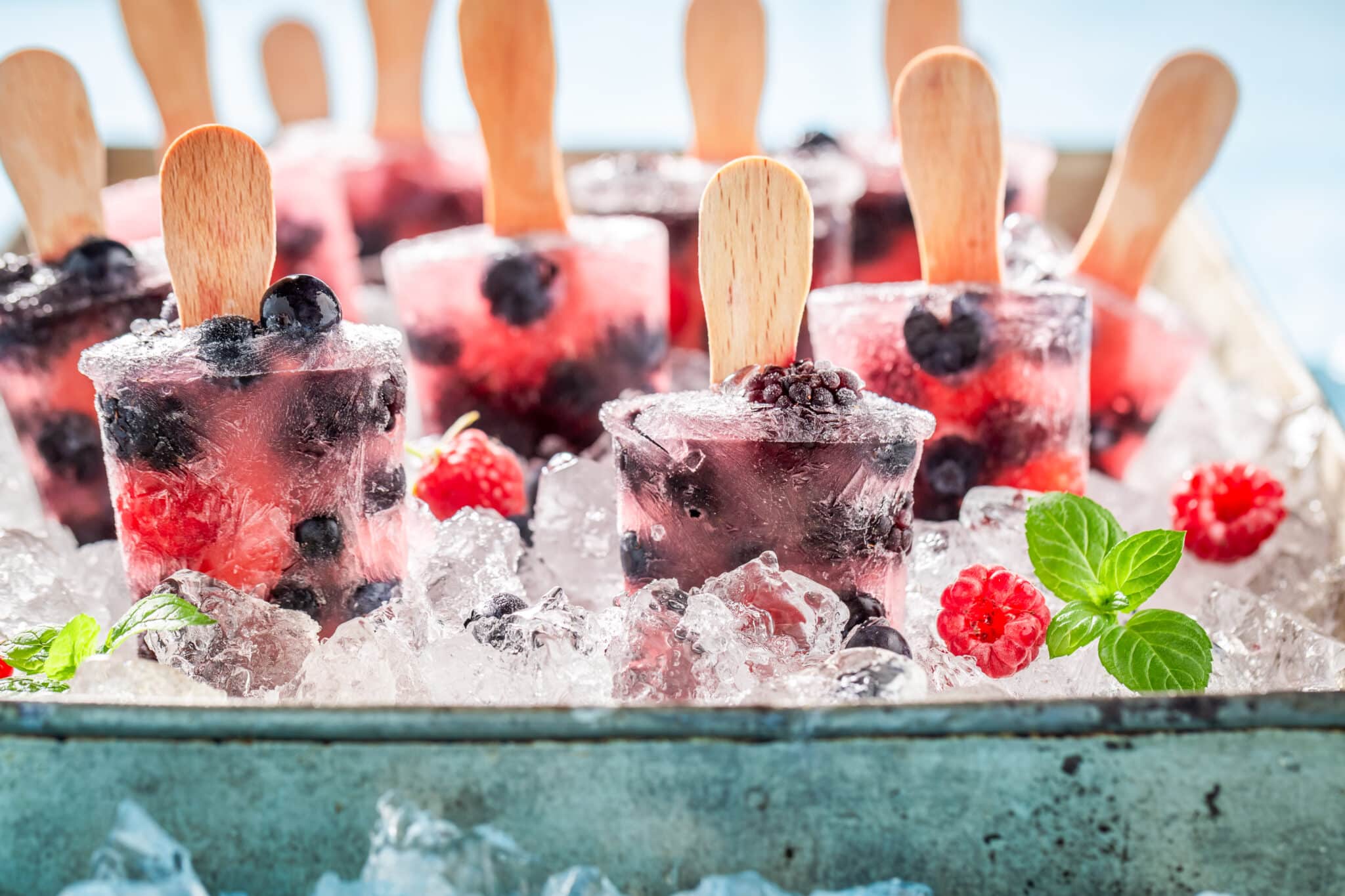 berry popsicles on ice