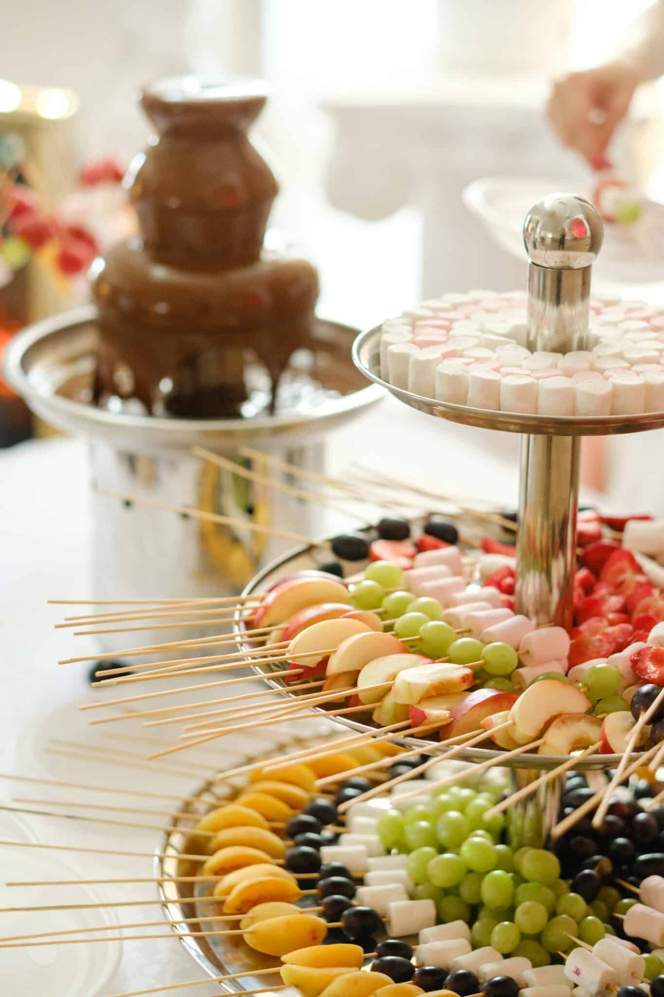 chocolate fountain with display of fruit and sweets for dipping