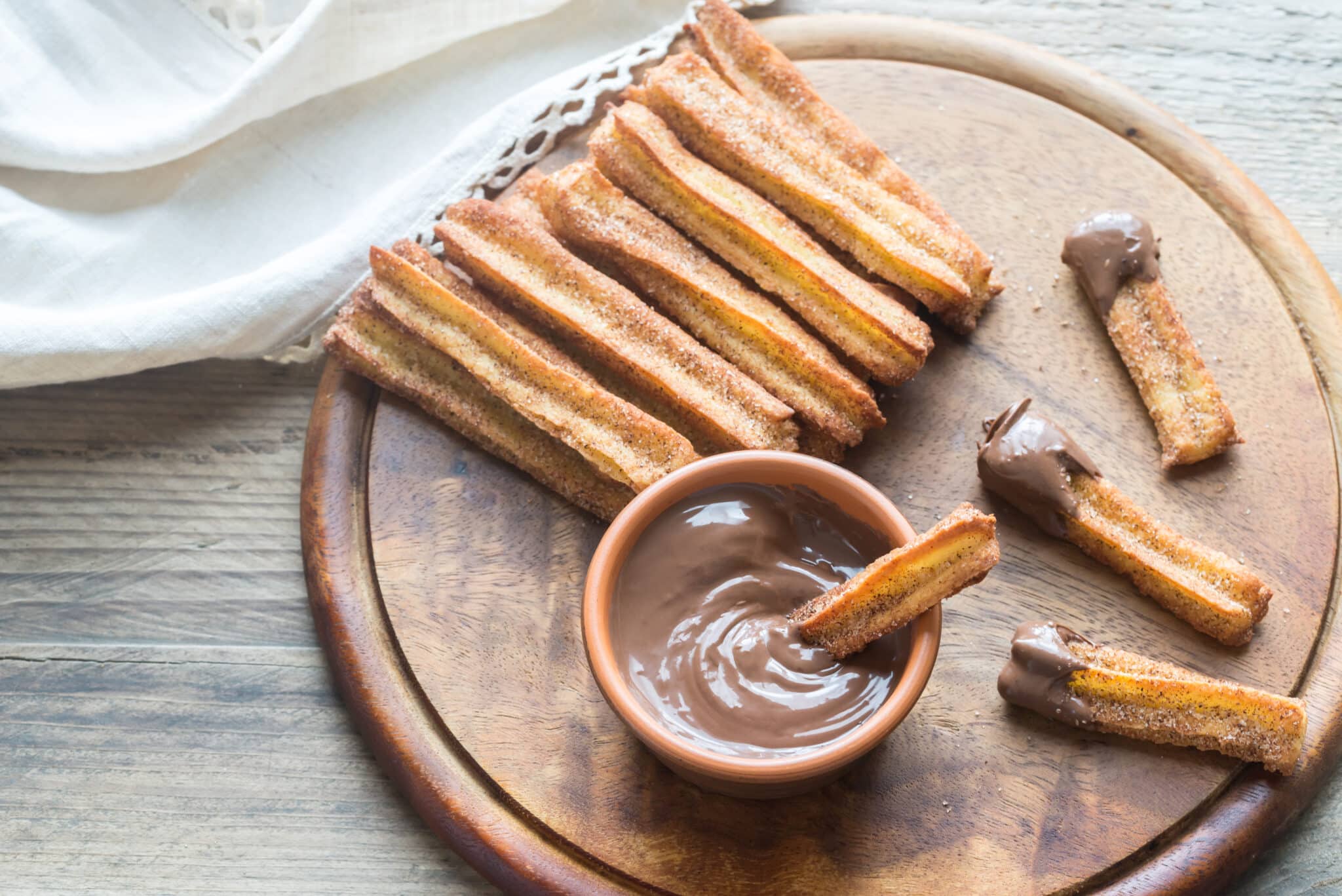 platter of churros with chocolate dipping sauce