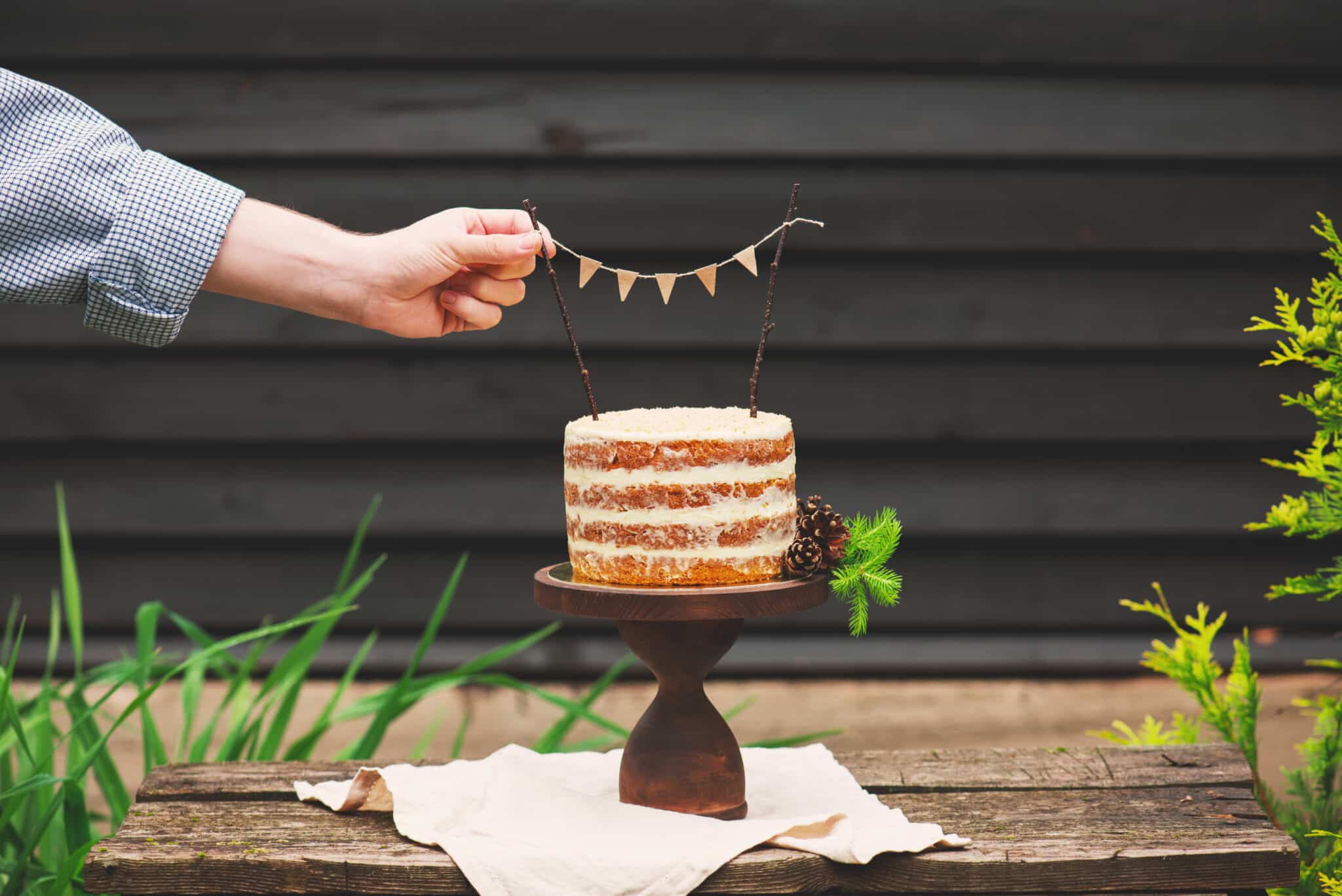 naked cake with bunting as cake topper
