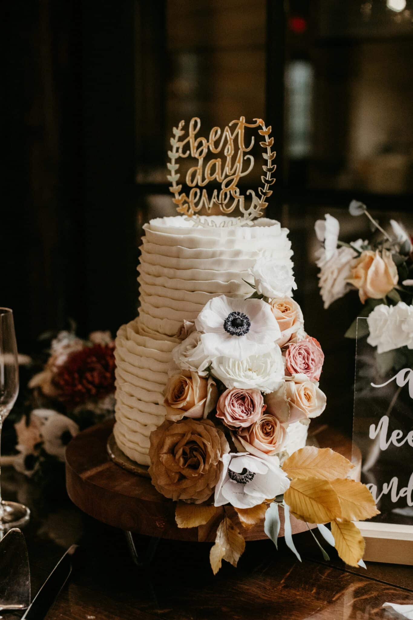 cute wedding cake with topper reading "best day ever"