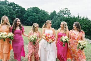 Flowing gowns in mixed jewel tones, plum, emerald, sapphire, for rich romanic feel. 