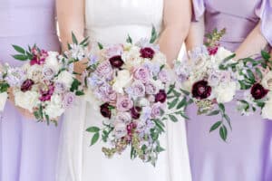 Deep purples, light purples soft lavender speak now vibe wedding flowers