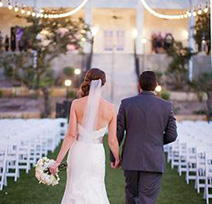 bride and groom walking up empty aisle