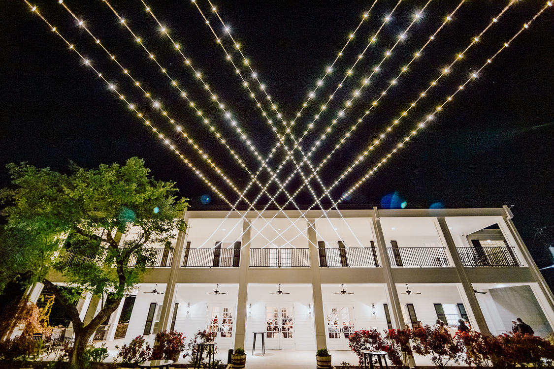 outside of Kendall Point wedding venue with gorgeous string lights