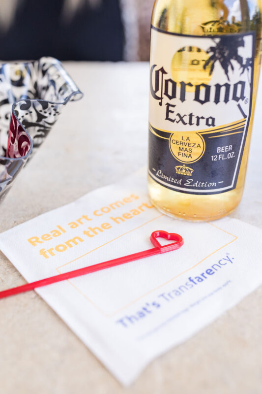 A Corona beer bottle sits atop a Southwest napkin.