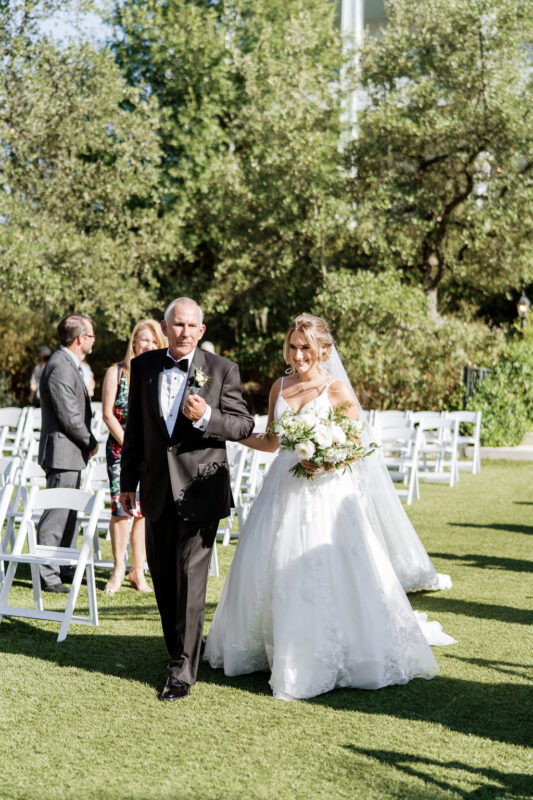 Bride walked down the aisle by her father