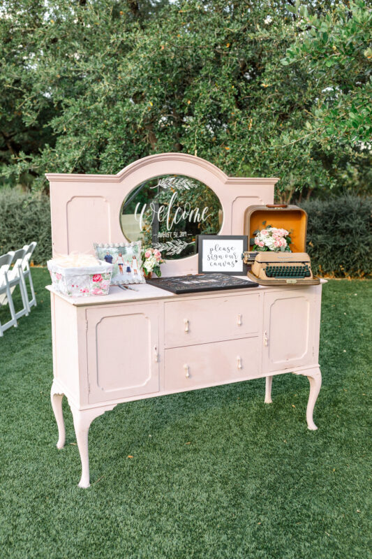 A vintage vanity in pale pink decorates this Kendall Point wedding.