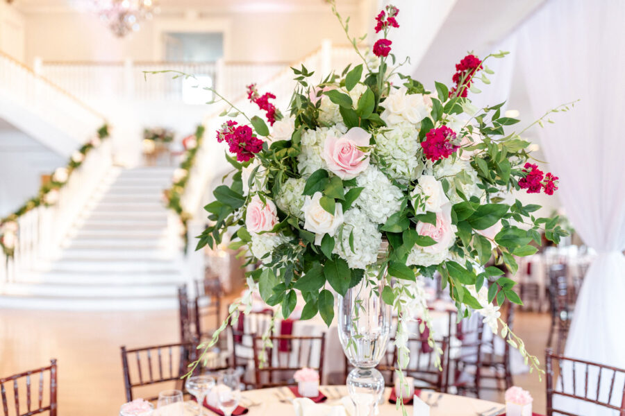 Red, pink and white floral centerpieces.