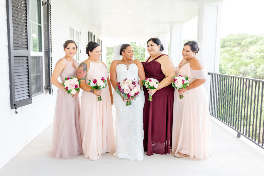 A bride and her bridal party on the Kendall Point balcony.