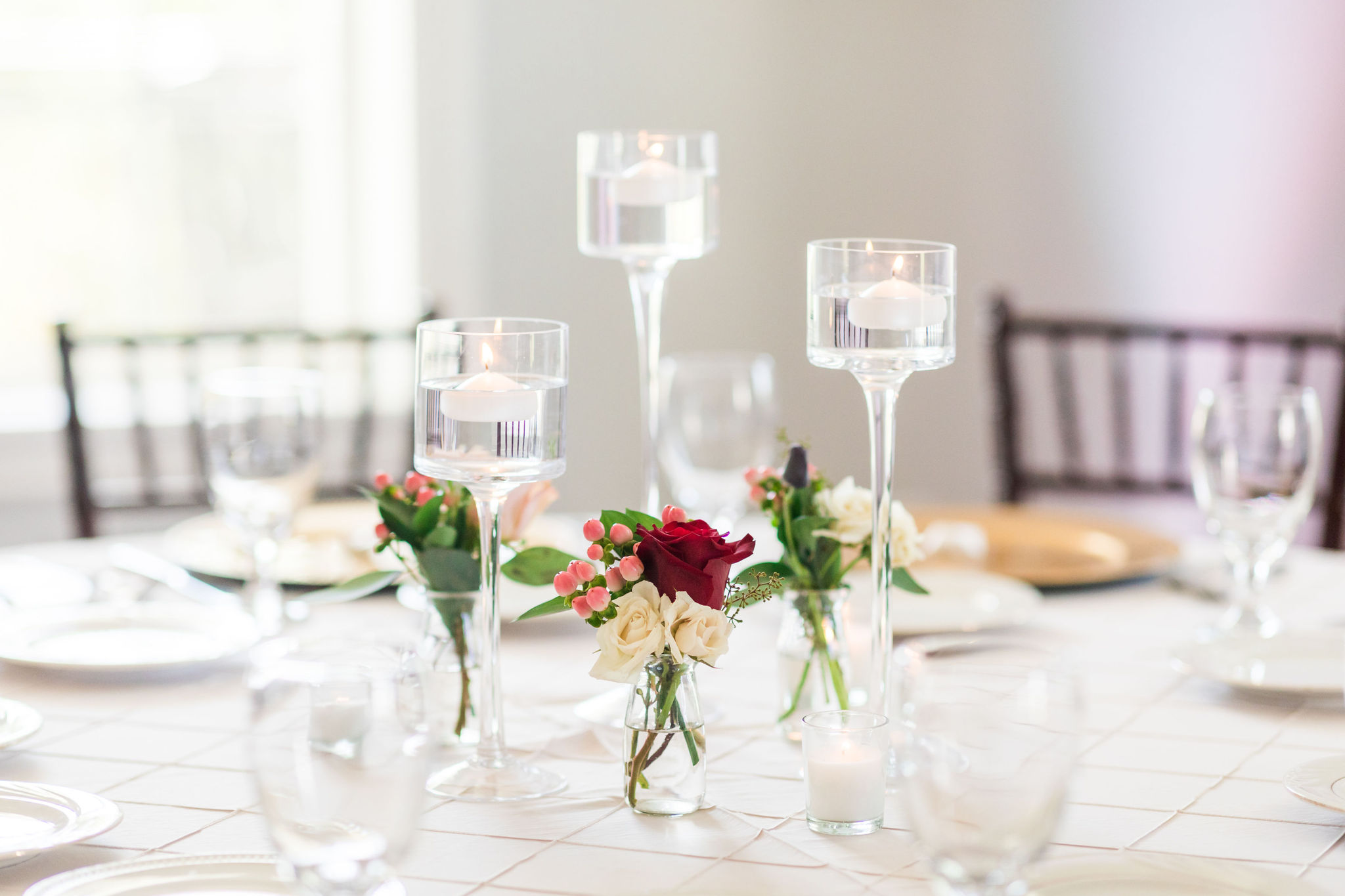 dainty wedding centerpieces with nosegays and candles