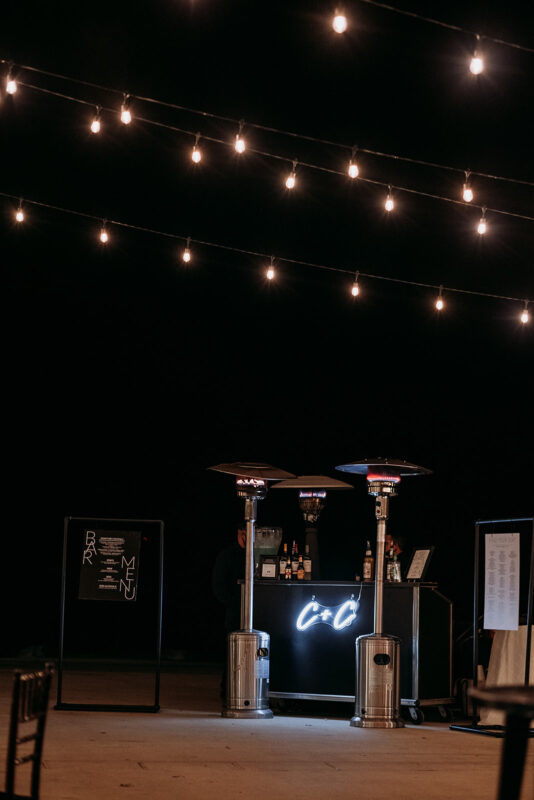 A special cocktail bar with the couple's initials illuminated. 