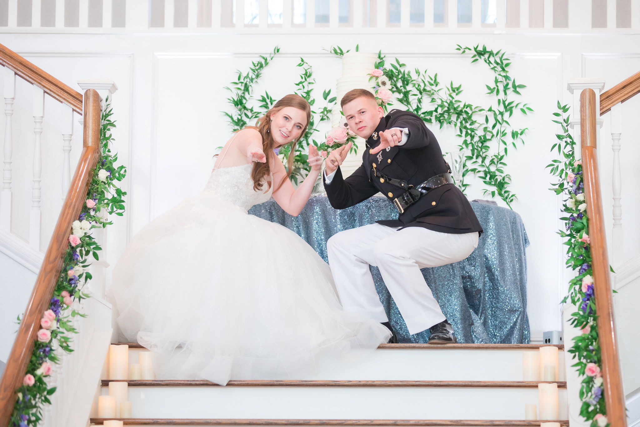 Bride and groom pose on the Kendall Point grand staircase