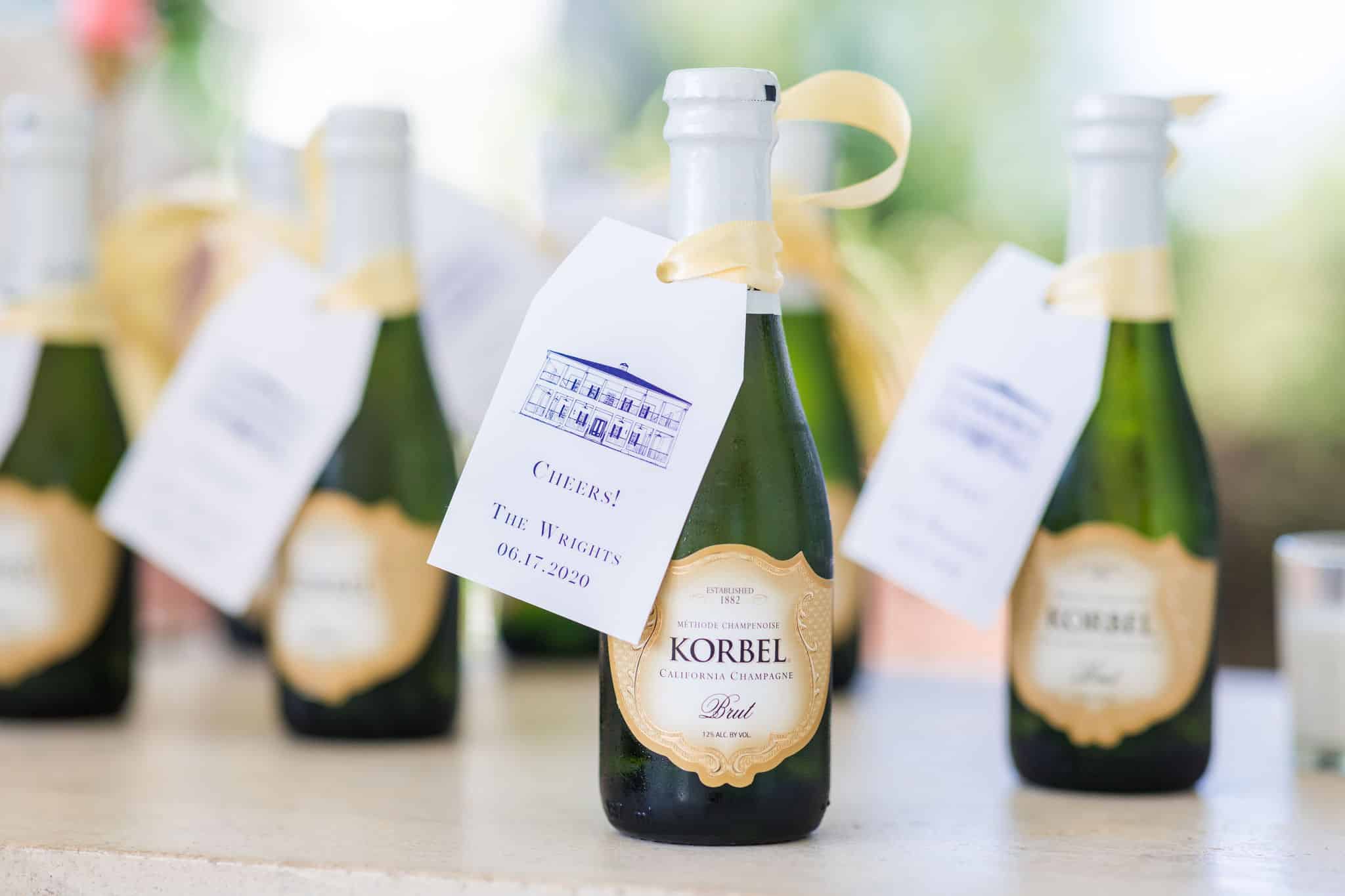 mini champagne bottles with the wedding date on the tag.