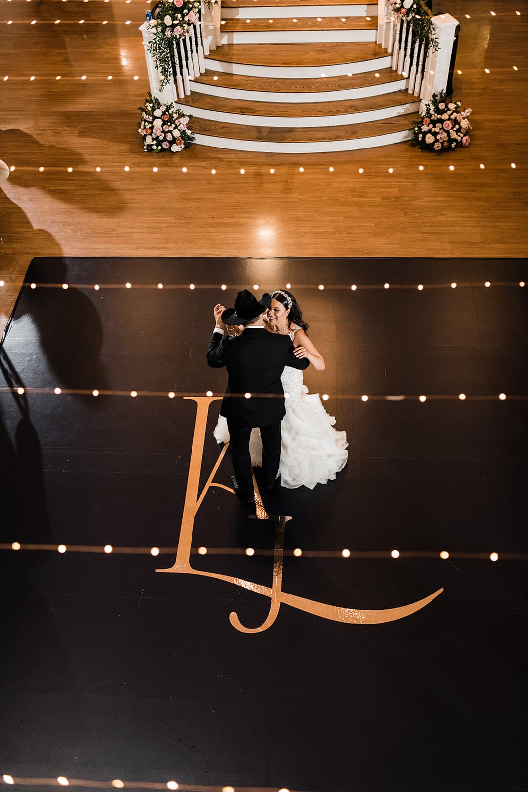 Audrey and Jerry's first dance on monogrammed dance floor