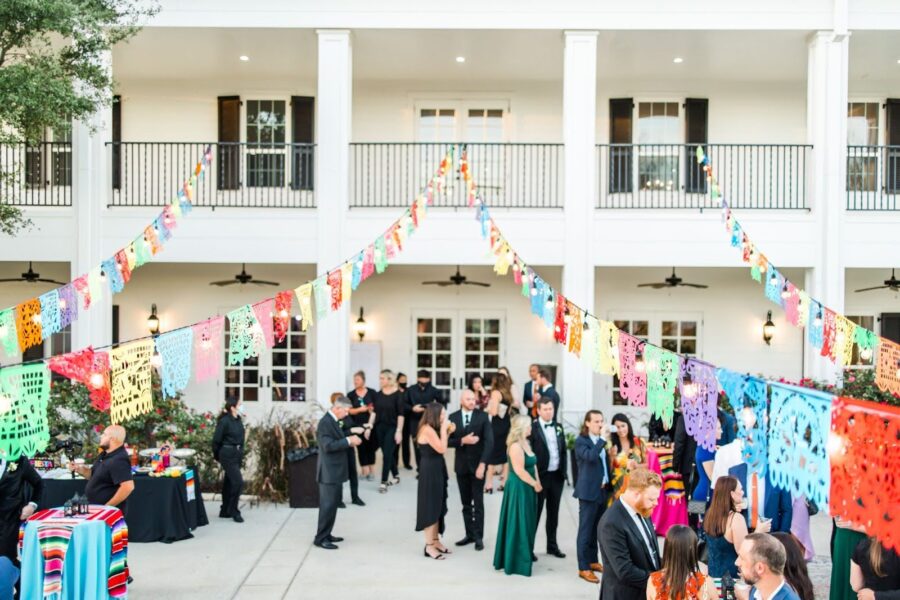 Colorful papel picados decorate the Kendall Point veranda during cocktail hour.