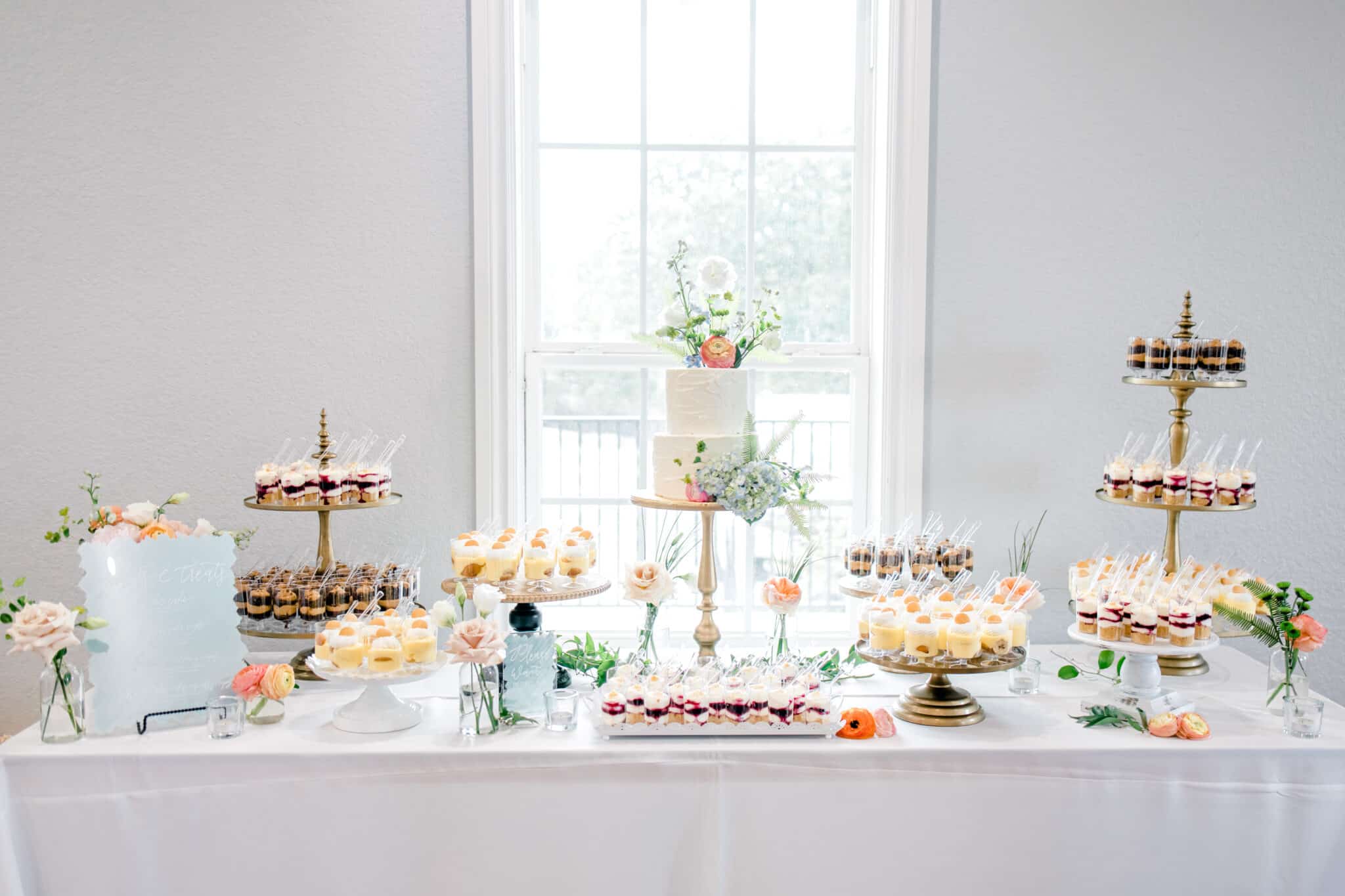 wedding dessert table covered in sweets