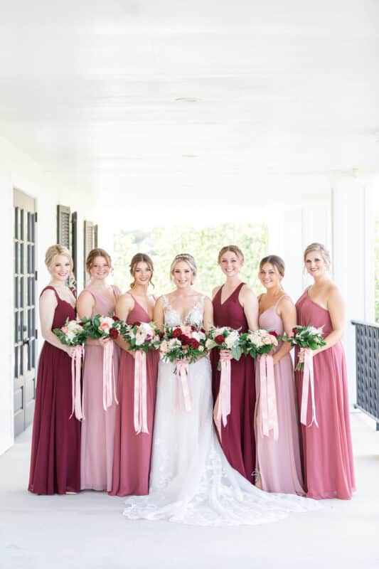 bride and bridesmaids standing on kendall point terrace