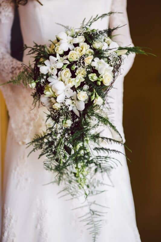 bride holding cascading bouquet