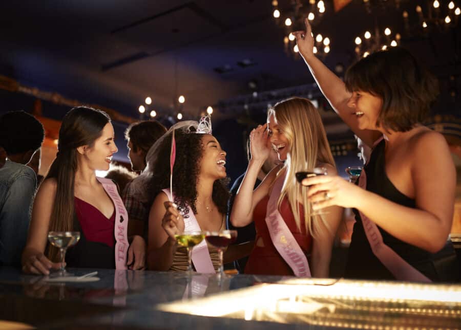 group of bridesmaids and bride celebrating at bachelorette party