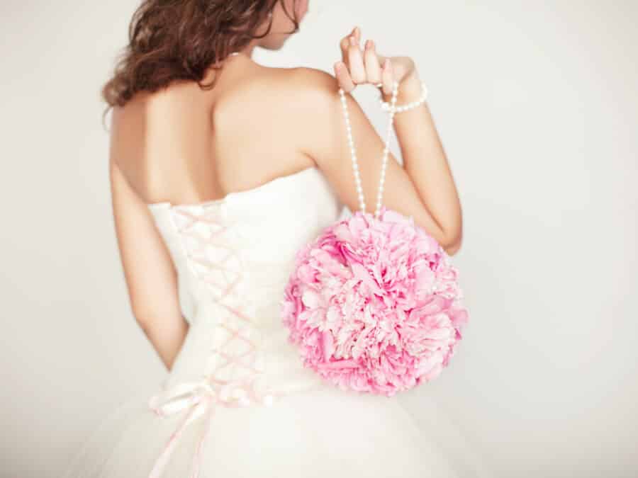 bride holding a pomander bouquet