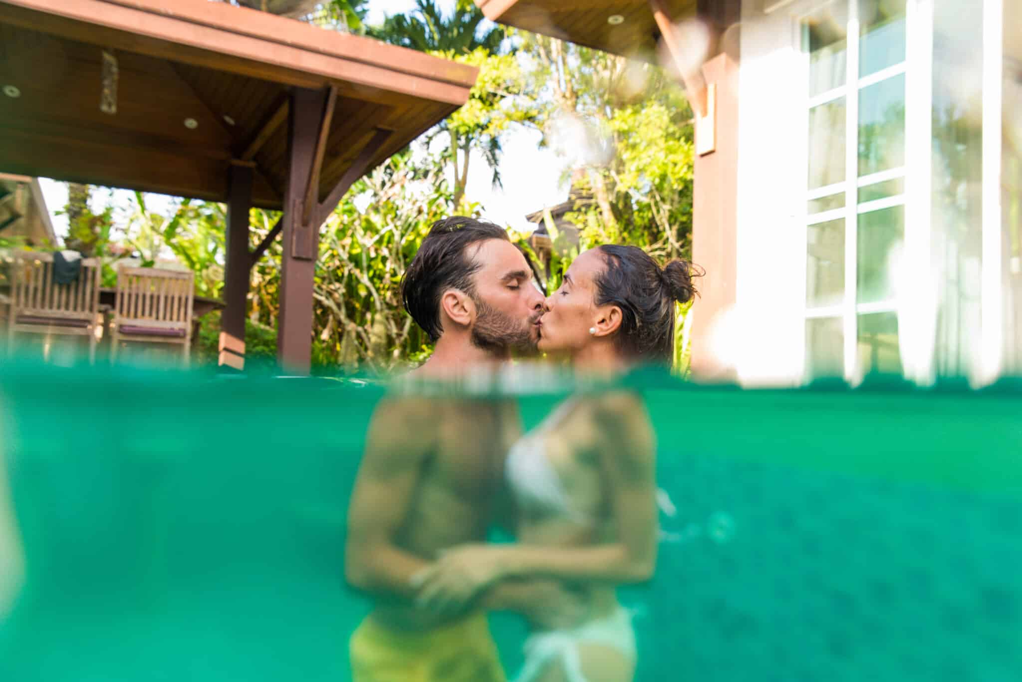 Couple of lovers in a beautiful villa with swimming pool in a tropical climate location