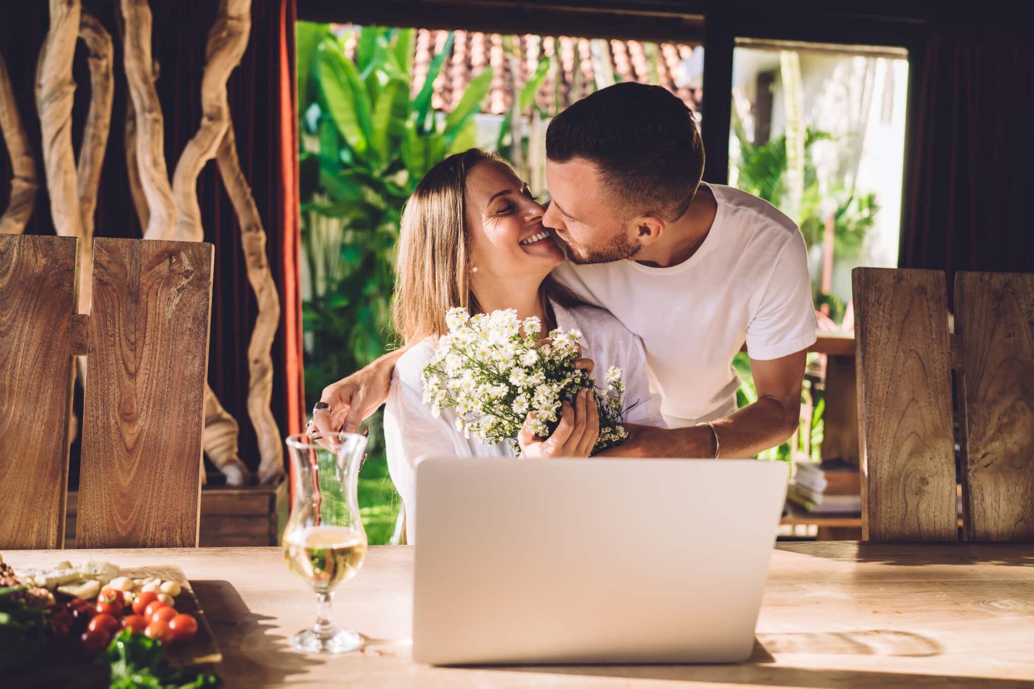 engaged couple on laptop together