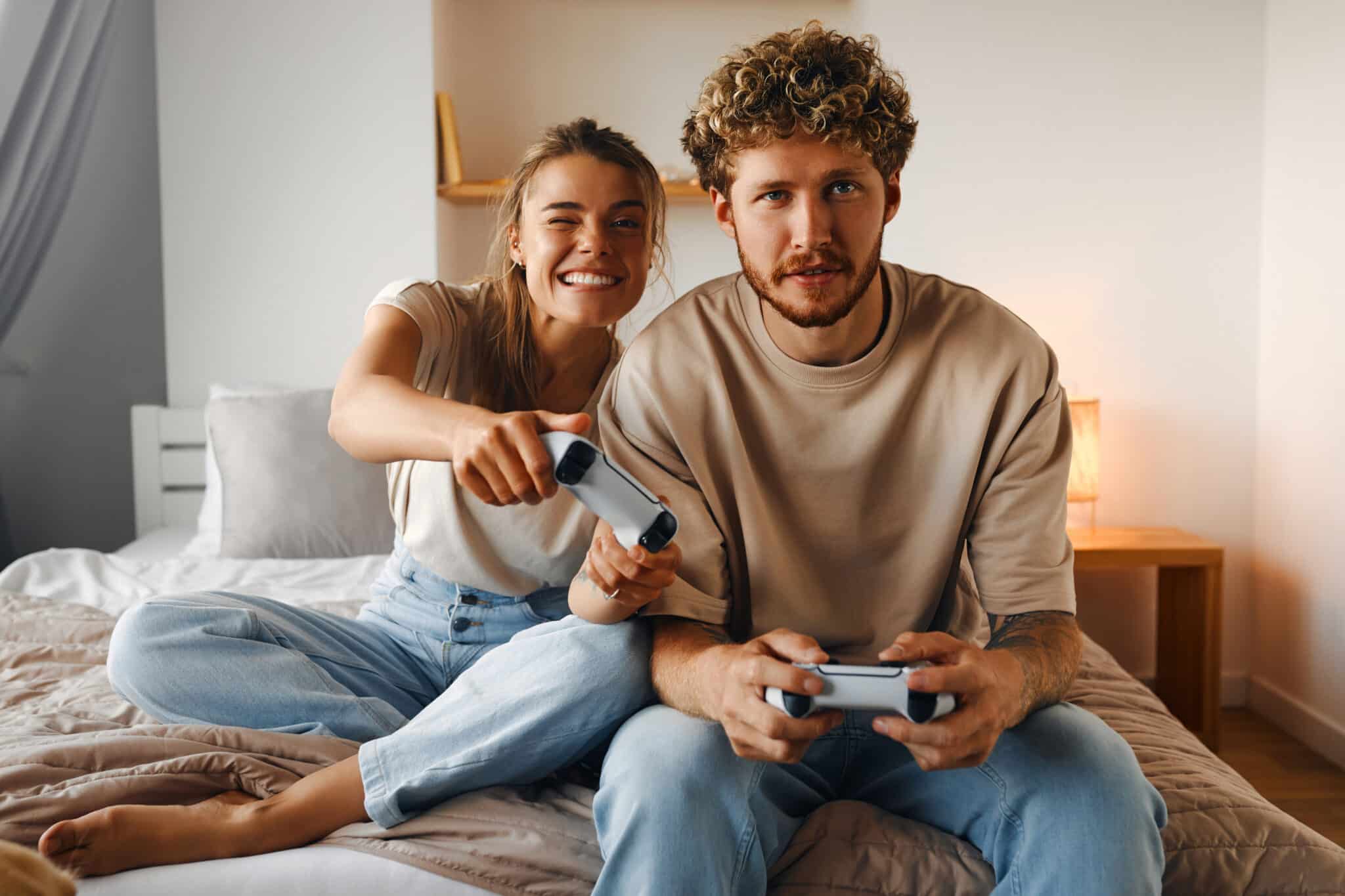 Young couple in love playing video games 