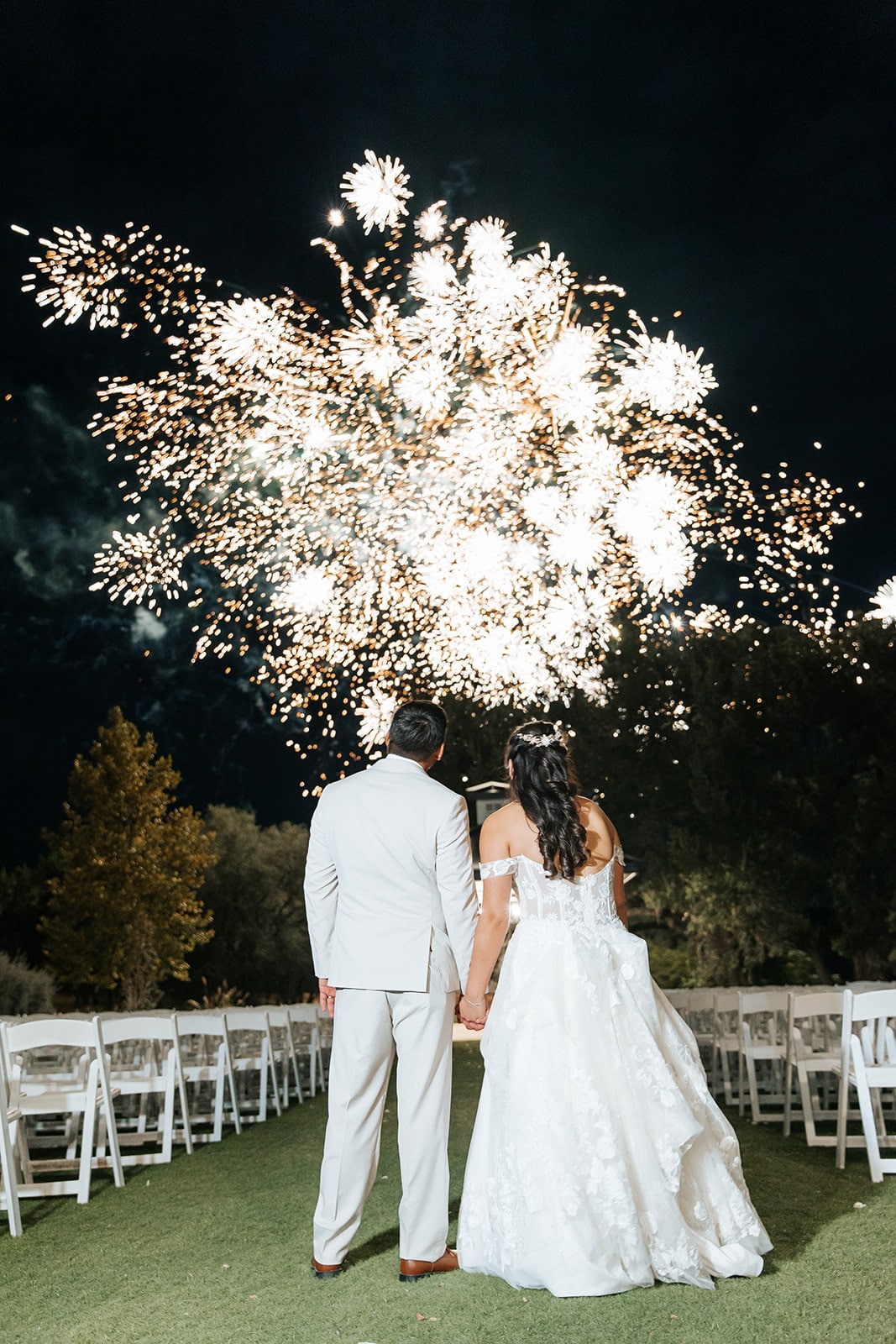 Bride and groom watching fireworks display at Kendall Point