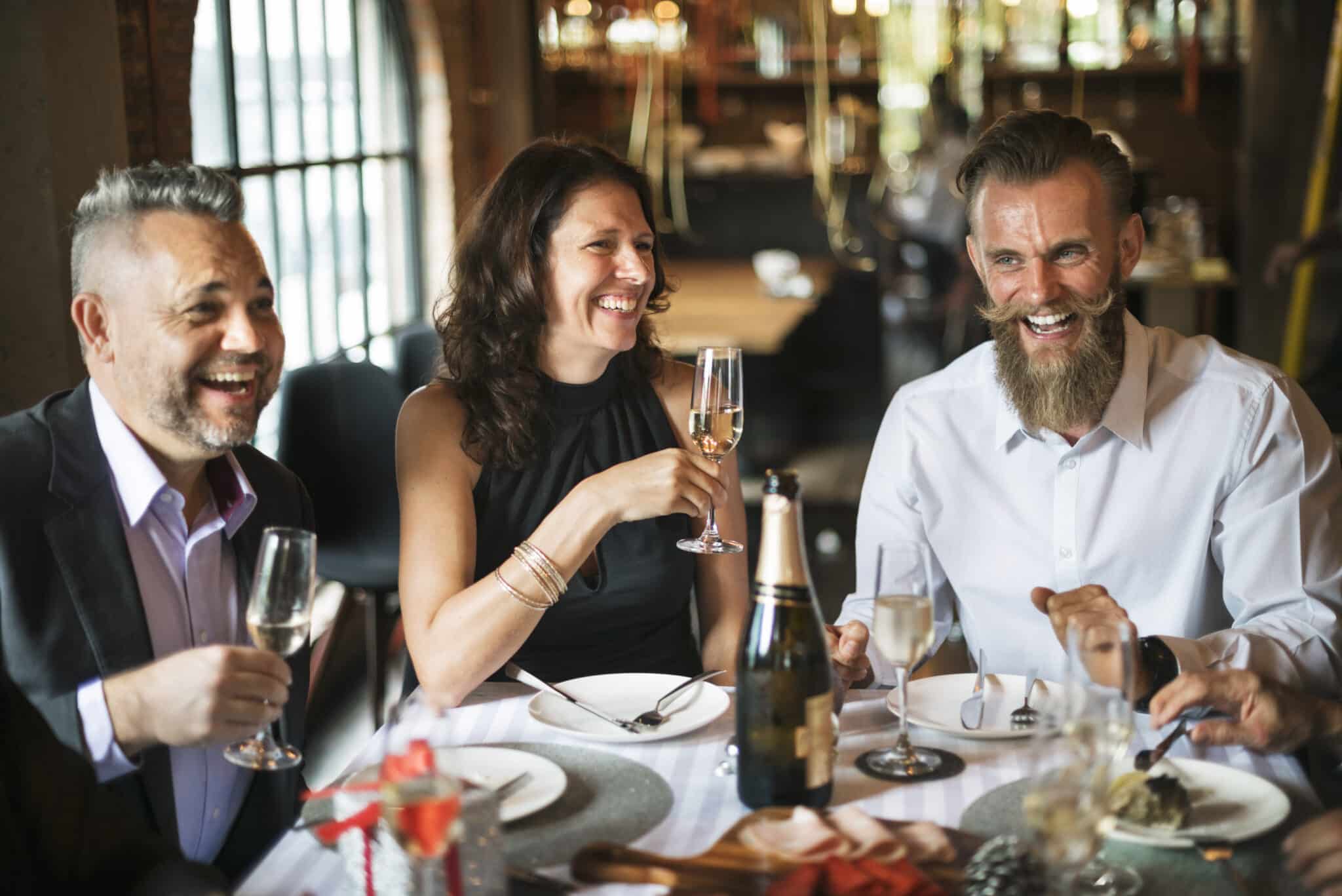 Three people sitting at restaurant