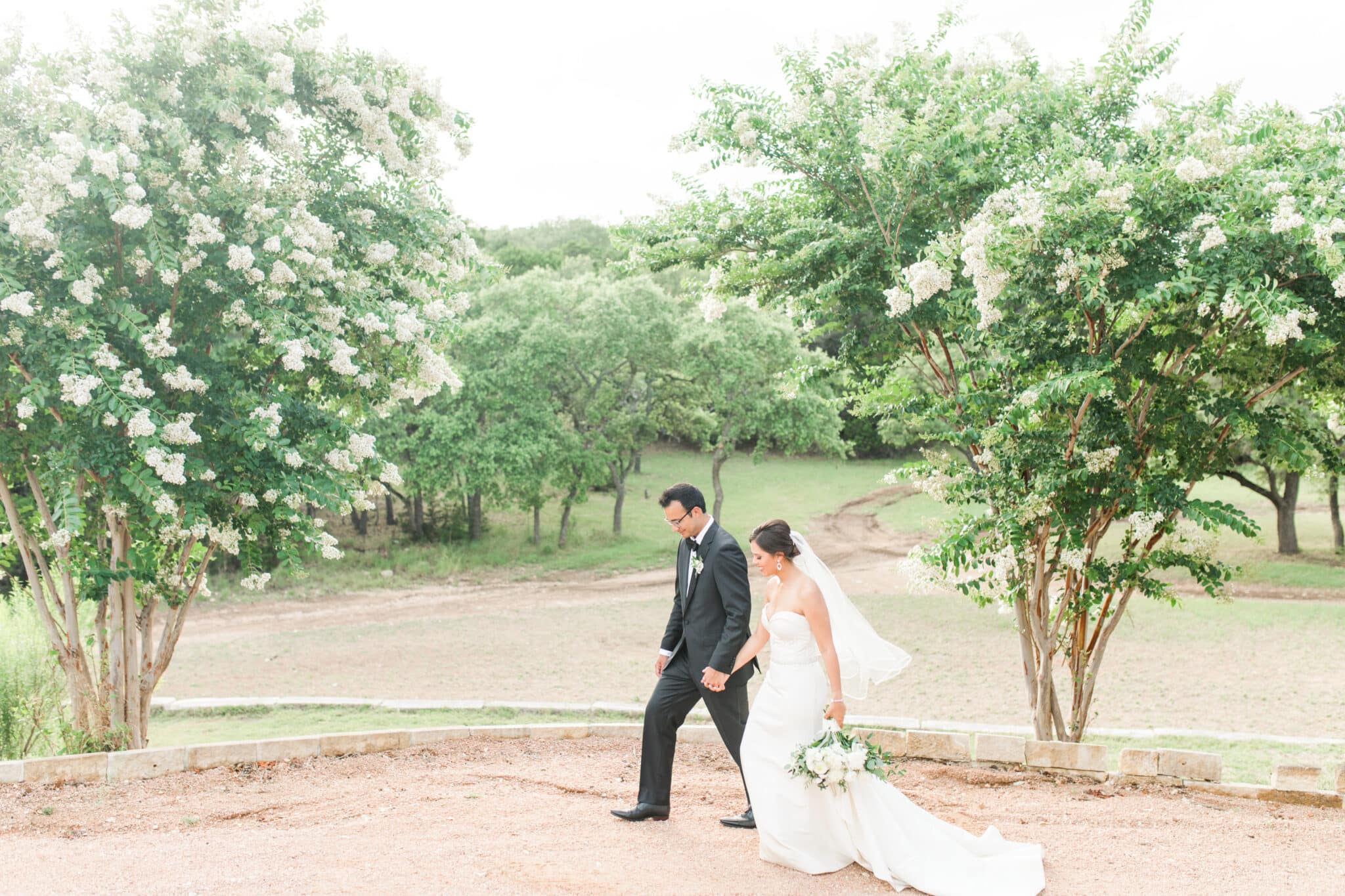 Bride and groom walking the grounds at Kendall Point for their destination wedding