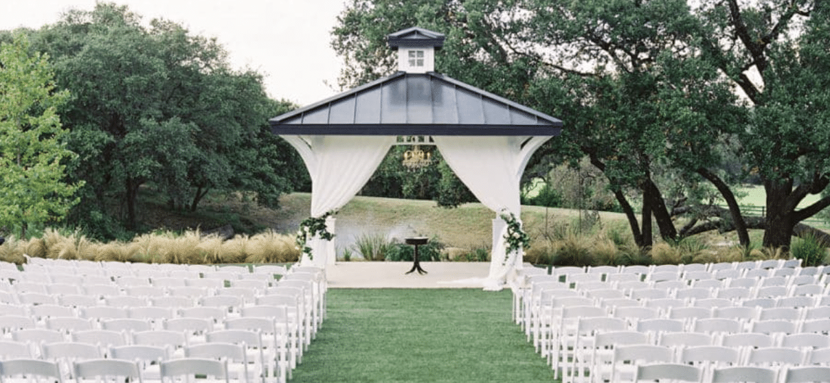 Wedding ceremony outdoors flowers.